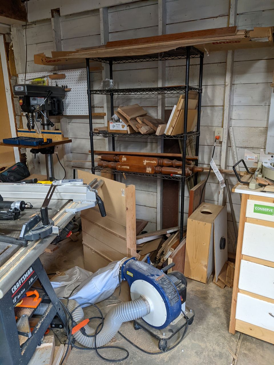 photo of messy shop with old lumber rack